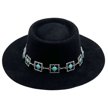 Black Frame – Teal Glyph